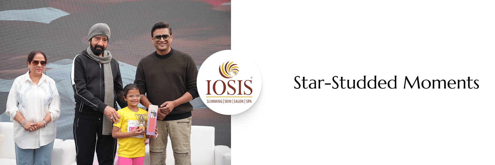 Image of R Madhavan distribuiting awards to junior marathon  participants at  IOSIS